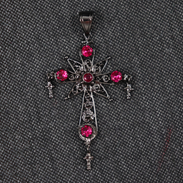 CROSS WITH RED GEMSTONES