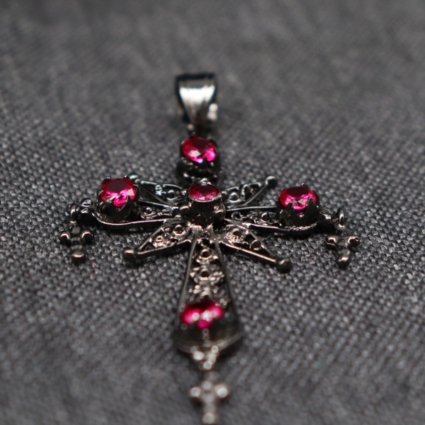CROSS WITH RED GEMSTONES